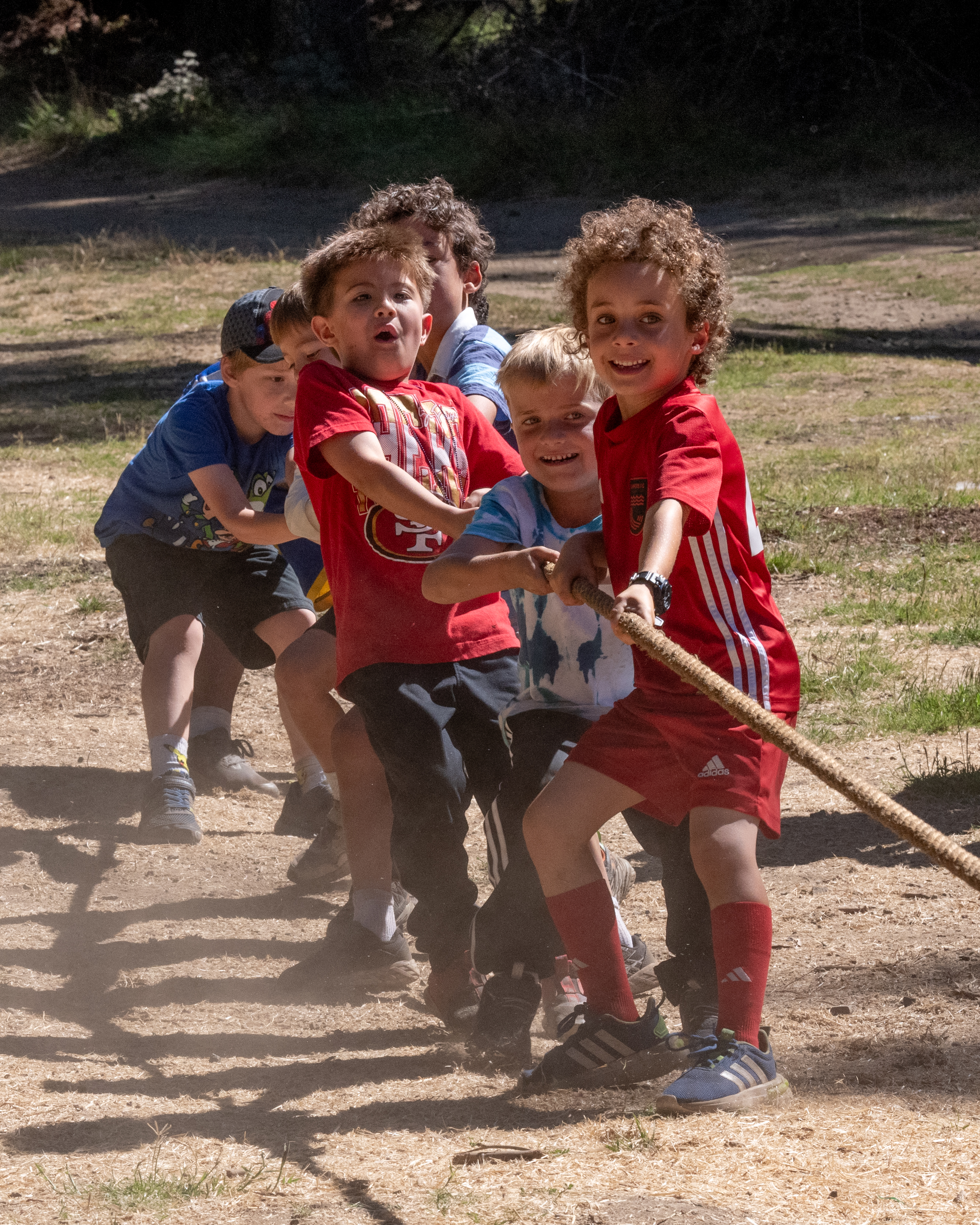 Kids playing tug of war at parish event